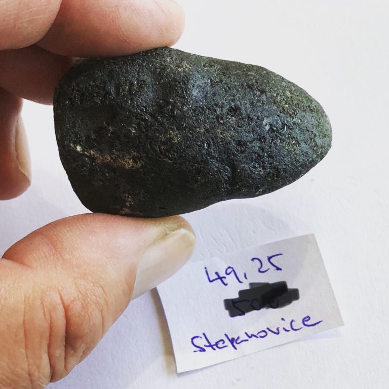 Example of large Stepanovice Moldavite (Moravia) with partially worn out surface showing typical crescent shaped dulciky